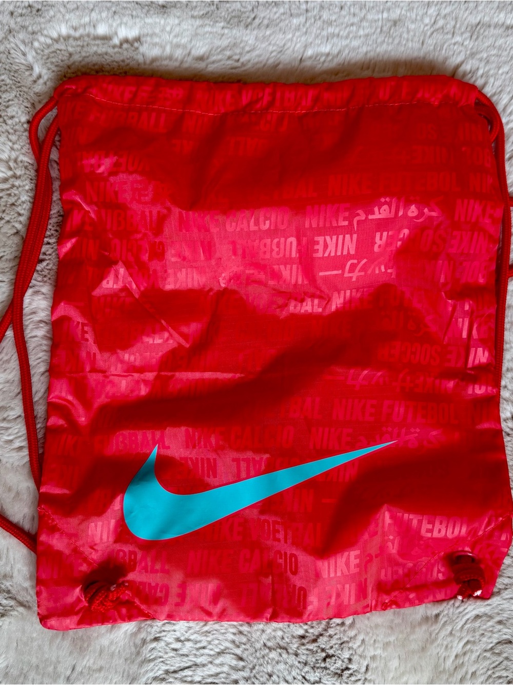 Nike Red Drawstring Backpack with Gray Swoosh